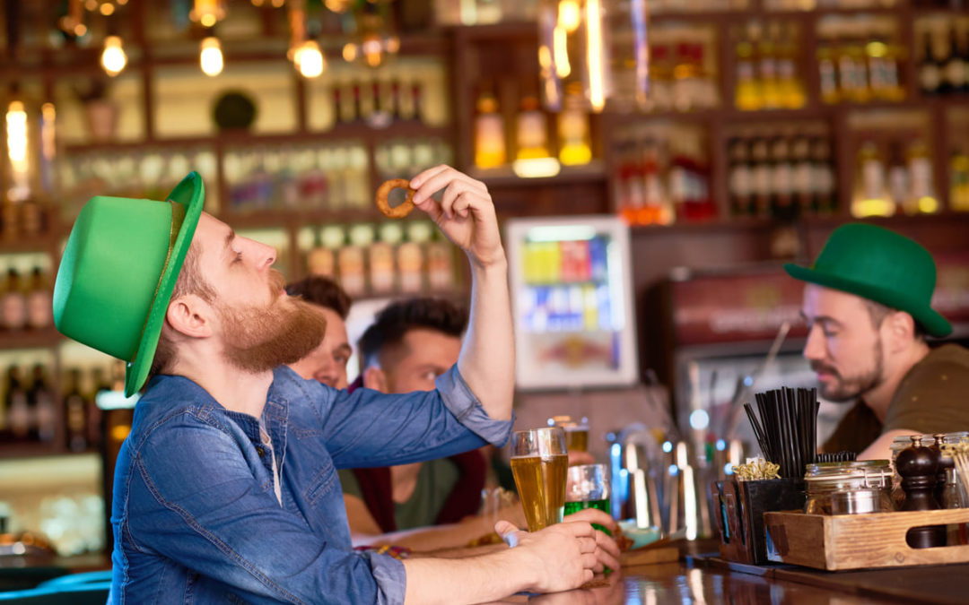guy drinking beer at a bar